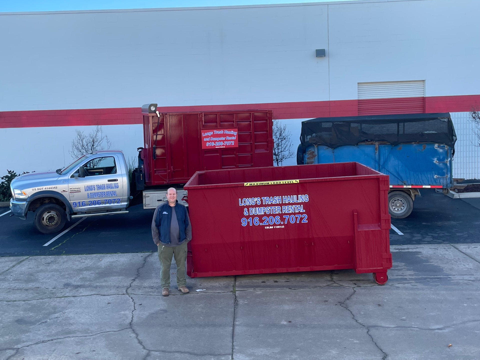 Jim Long with Long's Trash Hauling truck and 15 yard dumpster serving Sacramento