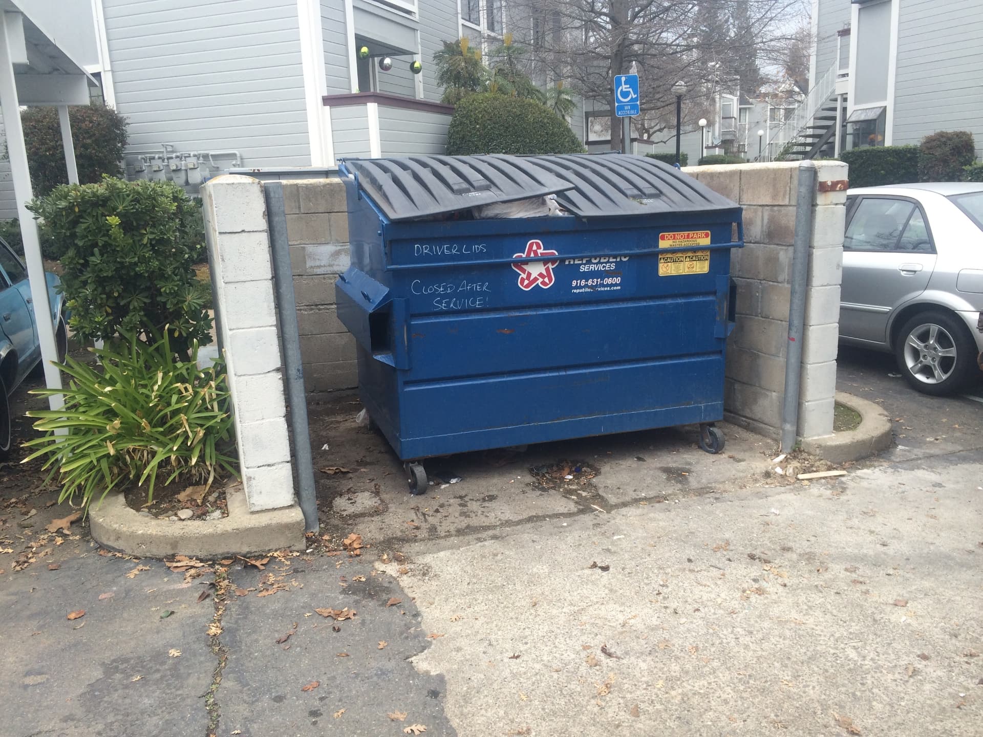 Apartment Dumpster Overflow after Long's Trash Hauling